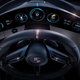 The curved OLED dashboard display adjusts to the driver’s seat position.